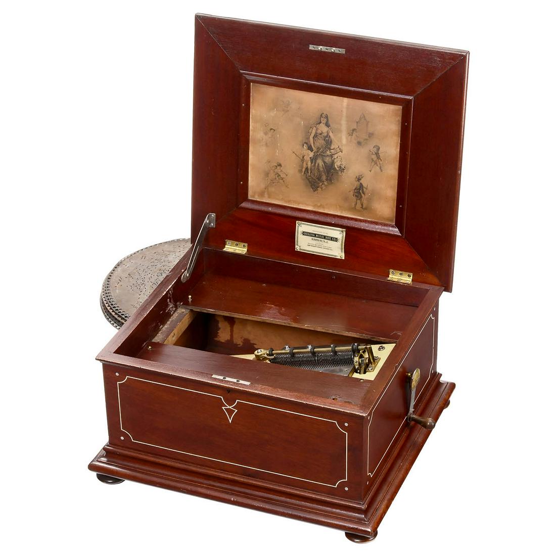 Regina 15 ¾-Inch Disc Musical Box, c. 1900: Regina 15 ¾-Inch Disc Musical Box, c. 1900 By Regina Music Box Company, Rahway, NJ. With 78 teeth in 2 combs (complete), mahogany case with lithograph in lid, mechanism in excellent restored play