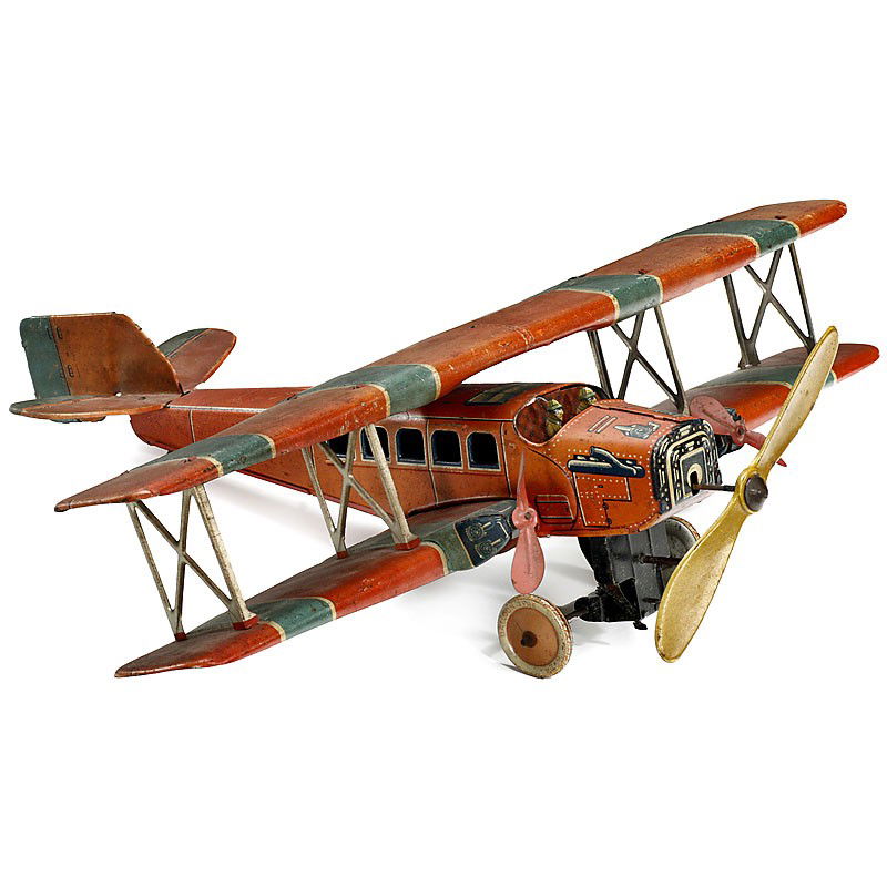 German Biplane "Grötsch", c. 1933: German Biplane "Grötsch", c. 1933 Manufactured by: "Georg Grötsch", Nuremberg, lithographed tin, clockwork-driven wheels and main propeller (working!), length: 19 1/3 in. - A very rare model from a