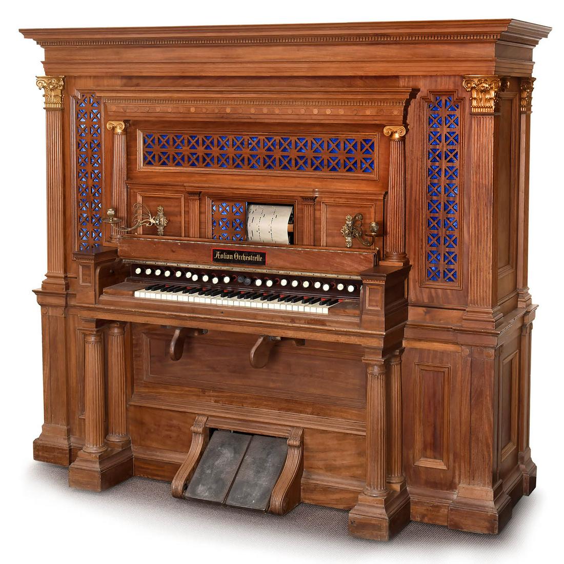 Aeolian Orchestrelle Player Reed Organ, c. 1900: Aeolian Orchestrelle Player Reed Organ, c. 1900 The Aeolian Company, USA. No. 2391, 58 notes, 20 stops, carved mahogany case, 80 x 29 ½ x 71 in., unrestored condition, with 50 music rolls in cabi