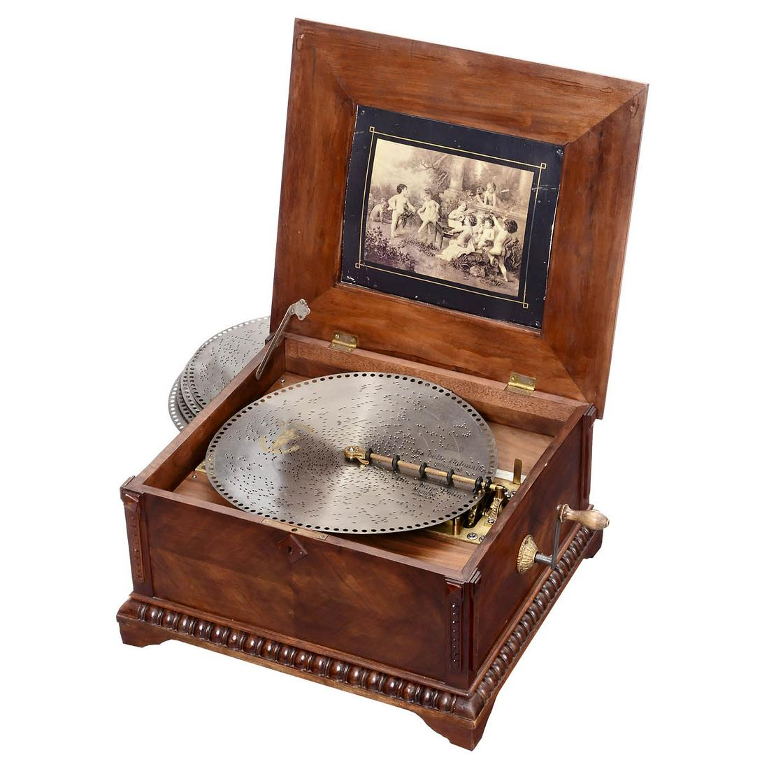 Polyphon Disc Musical Box, c. 1900: Polyphon Disc Musical Box, c. 1900 Polyphon Musikwerke, Leipzig, for 15 3/4-inch discs, with 154 teeth in duplex music comb (complete), restored walnut case with original lithograph in lid and 5 discs