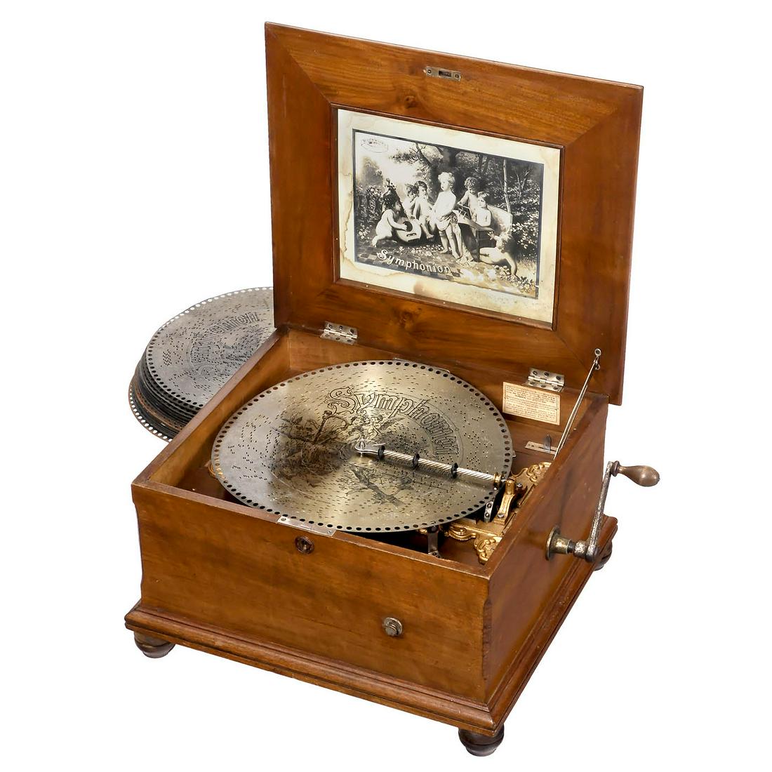 15 ¾-inch Symphonion No. 257 Disc Musical Box, c. 1900: 15 ¾-inch Symphonion No. 257 Disc Musical Box, c. 1900 Symphonion Musikwerke, Leipzig. 156 teeth in duplex music comb (complete), walnut case, original lithograph in lid, good playing condition, 