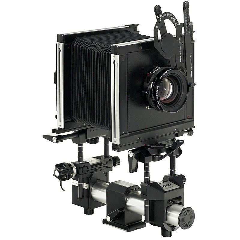 Sinar F Studio Camera with 4 Lenses: Sinar F Studio Camera with 4 Lenses Sinar, Switzerland. Size 4 x 5 in. With compendium (lens shade), Cambo rollfilm cassette 120 (6 x 7 cm), Polaroid cassette, base tube extension, 12 cassettes and 4 
