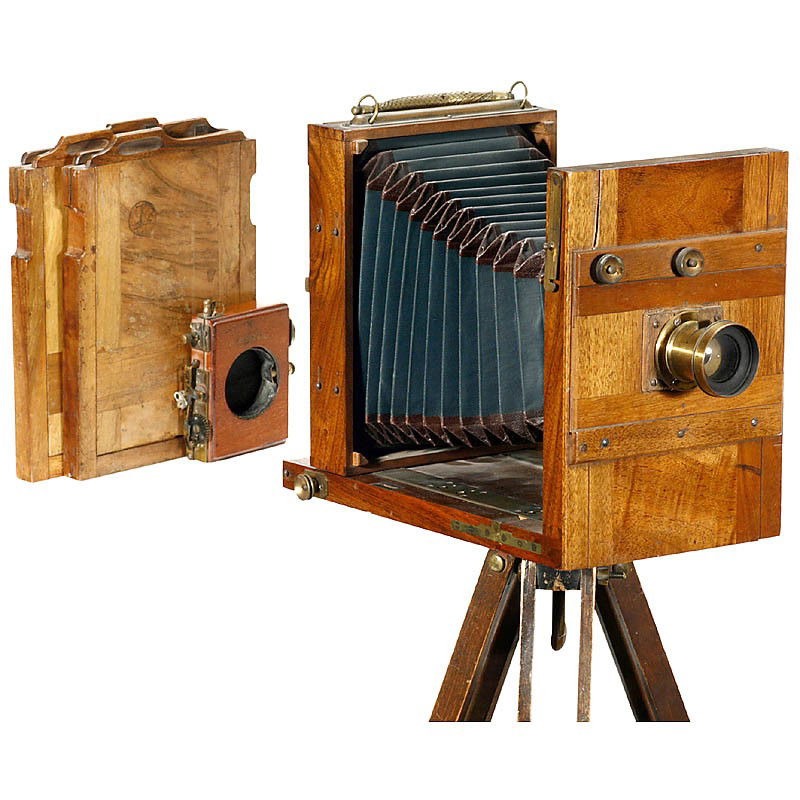 German Tailboard Camera, c. 1880: German Tailboard Camera, c. 1880 Presumably Herbst & Firl, Görlitz. Size 13 x 18 cm, conical green bellows with brown leather corners, metal grip, brass fittings, walnut body, unmarked brass lens wit