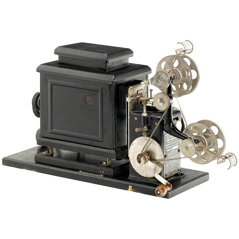 "Edison Home Kinetoscope", 1912: "Edison Home Kinetoscope", 1912 The grandfather of the modern "home video": Edison's ingenious movie projector for 22mm film with triple rows of pictures (4 x 5 mm) and with double perforation inside!