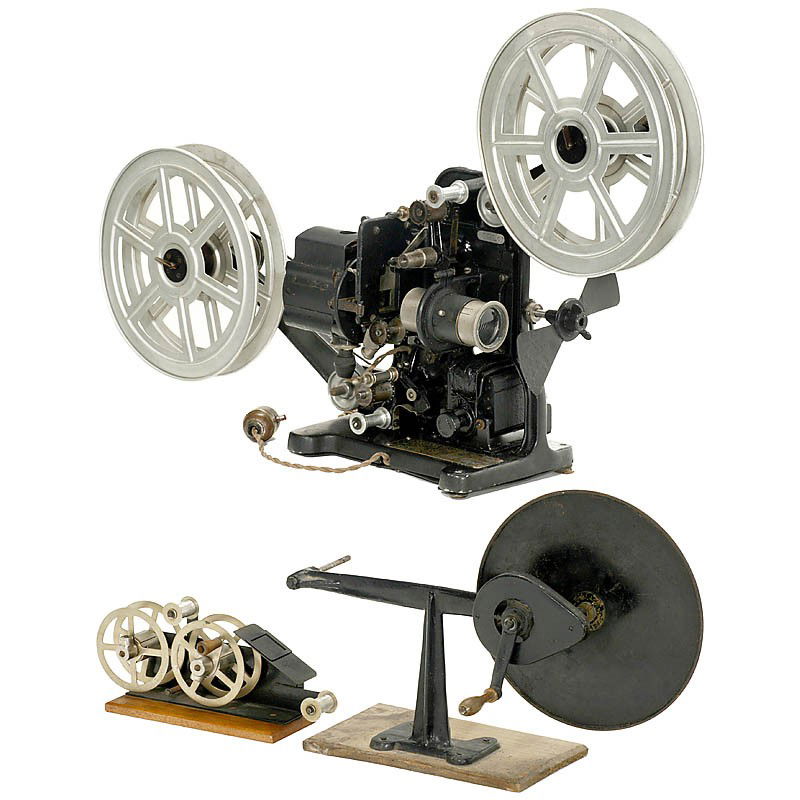 Table Movie Projector, c. 1925: Table Movie Projector, c. 1925 Peerless, New York. Silent movie projector for 35mm film on 300m reels, electric motor drive, Geneva movement, front diaphragm, with lens, small lamp housing. With origi