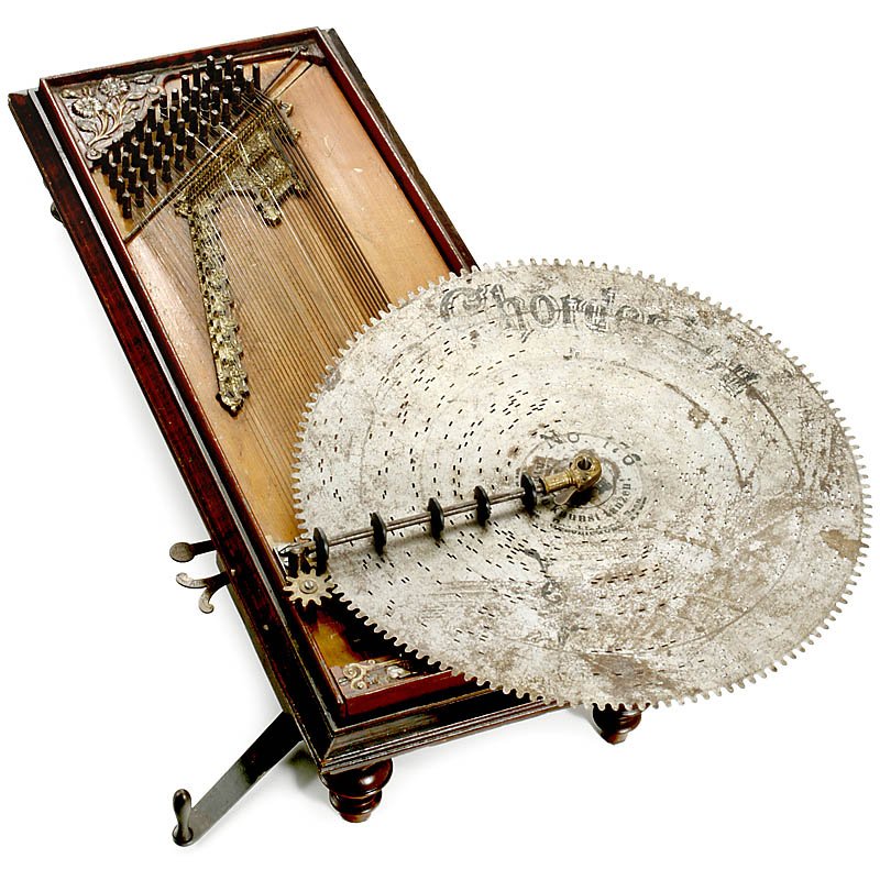 Mechanical "Chordephon" Zither, c. 1905: Mechanical "Chordephon" Zither, c. 1905 Manufactured by: "Claus & Co., Leipzig", model 15-A, clockwork motor, 44 notes (2 strings missing), in playing condition, but needs tuning, with 4 discs.
