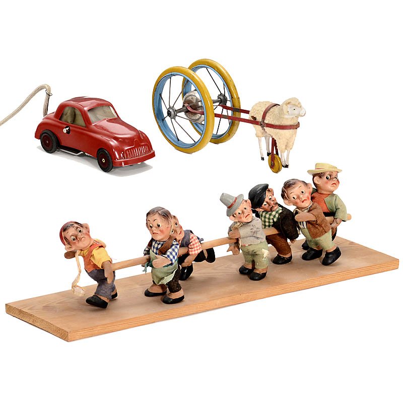 3 Toys, 1948: 3 Toys, 1948 1) Clockwork car by "Domo", Italy, Fiat model, plastic case, 1948. - 2) 7 character figures, rubber with felt clothes, c. 1950. - And: 3) Bell toy, sheep with bell wheel, unmarked, c. 192