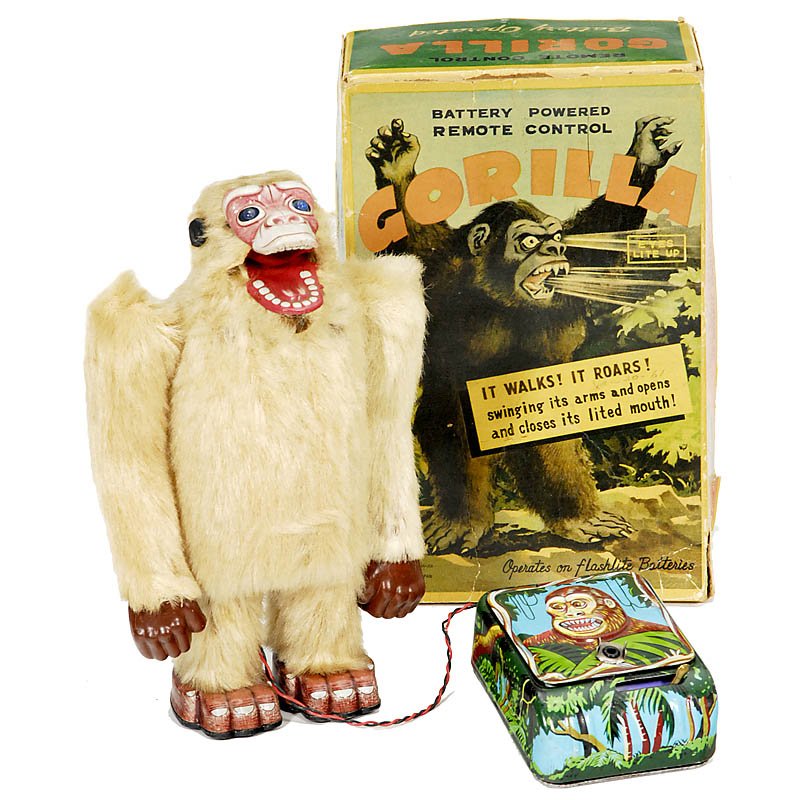 Japanese Battery Toy "Gorilla": Japanese Battery Toy "Gorilla" Manufactured by "TN (Nomura)", tin toy, partly lithographed. The monkey walks and roars while his eyes light up, height 9 1/2 in., original box. - Good condition, workin