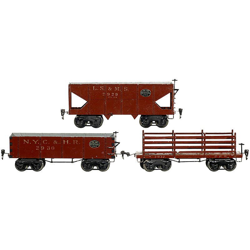 3 American Freight Wagons "Märklin" Gauge I, c. 19: 3 American Freight Wagons "Märklin" Gauge I, c. 1925 1) Coal wagon no. 2929. - 2) High-sided wagon no. 2930. - And: 3) Open cattle wagon no. 2932. - All wagons with double bogies, original finish. 3