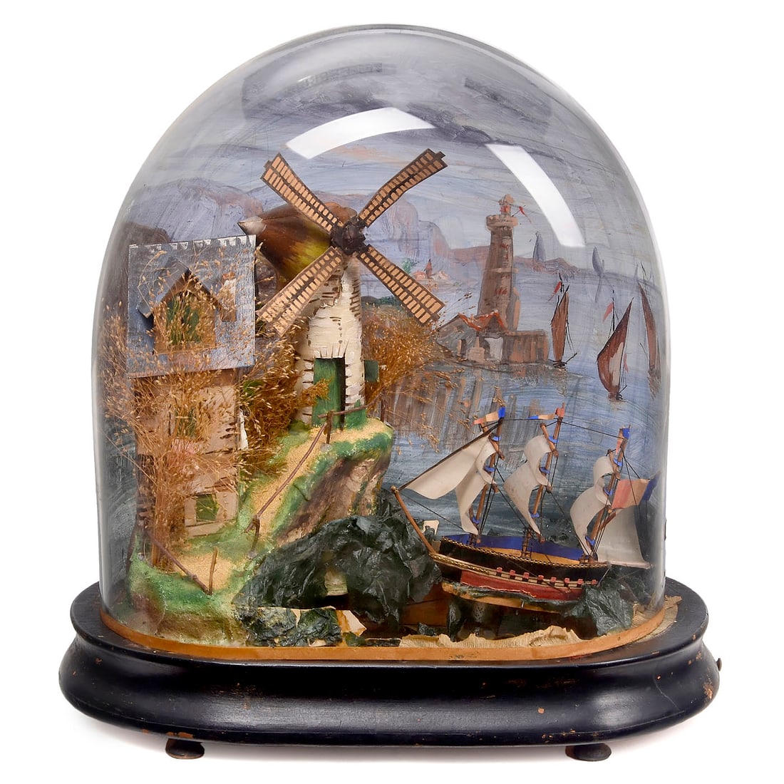 Musical Seascape Automaton, c. 1890: Musical Seascape Automaton, c. 1890 Depicting a three-masted ship on stormy sea, windmill with turning sails and house on cliff, with pull-string musical movement, ebonised oval base, painted glass do
