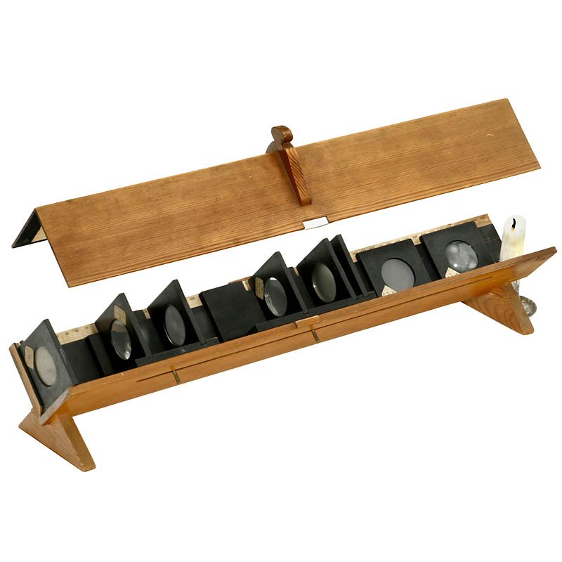 Optical Bench, c. 1920: Optical Bench, c. 1920 Sweden. Scientific apparatus for students, demonstrating optical applications of the microscope, projection (e.g. magic lantern), telescope, etc. Wooden angular base frame 52 x 