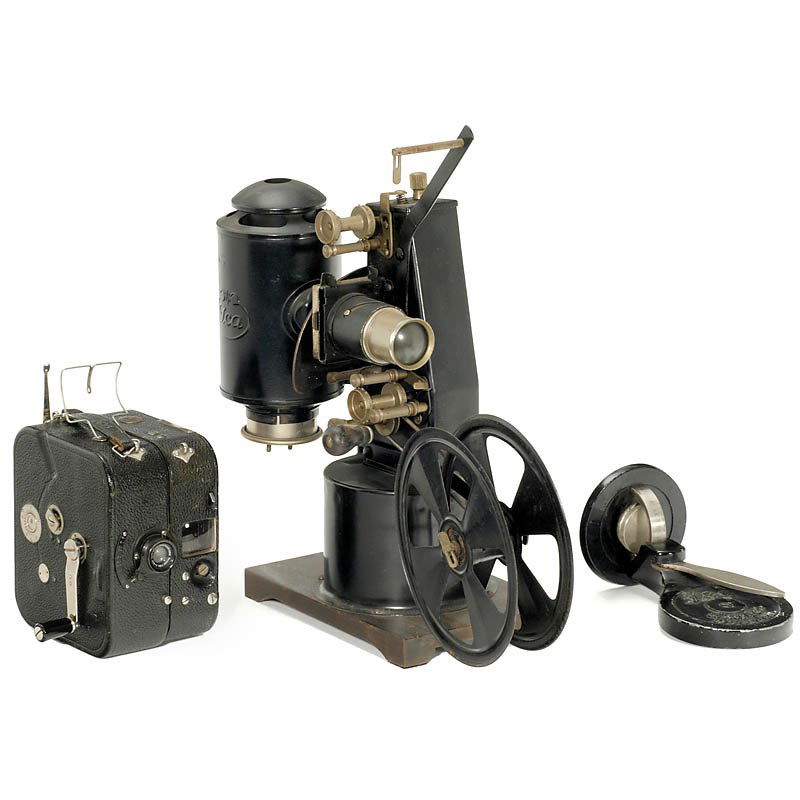 Ica Movie Camera and Projector, c. 1922: Ica Movie Camera and Projector, c. 1922 Ica, Dresden. 1) Kinamo 25, 35mm movie camera, cassette inside, with attached clockwork motor (working) and handcrank. Lens: Zeiss Tessar 1:3,5/40 mm, Newton an
