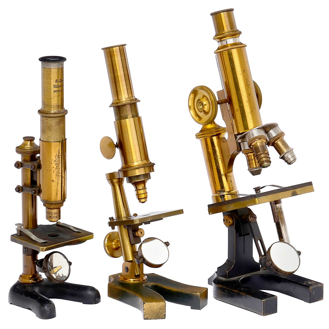 3 Brass Microscopes, c. 1895: 3 Brass Microscopes, c. 1895 1) E. Leitz, Wetzlar, no. 25137, height 10 1/5 in. - 2) Unmarked, probably Austria, triple revolver, height 11 3/5 in. - And: 3) Unmarked, green-and-gold-painted cast base