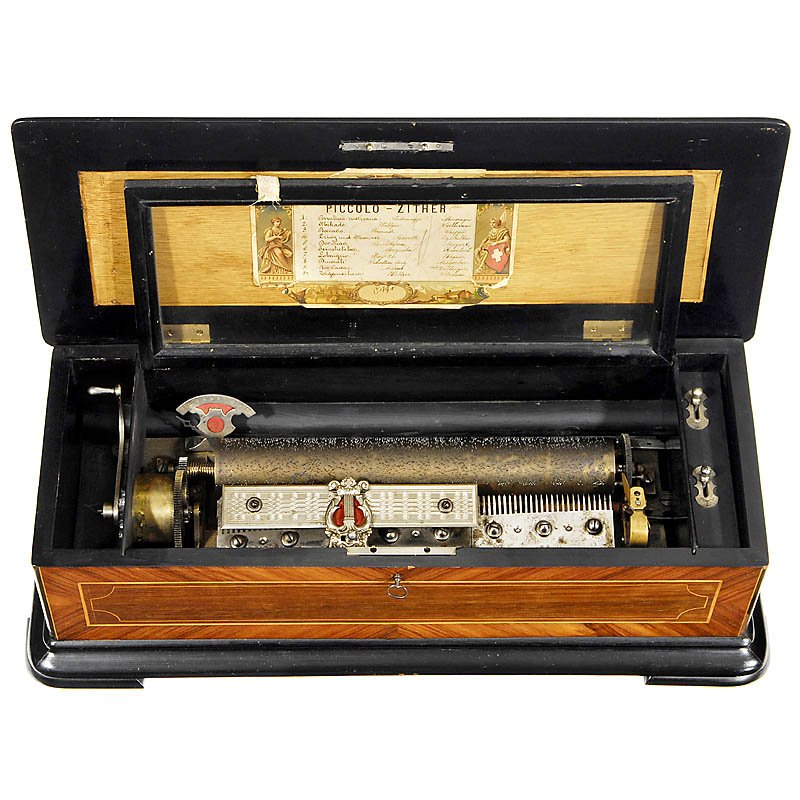 Piccolo Zither Musical Box by Paillard, c. 1880: Piccolo Zither Musical Box by Paillard, c. 1880 No. 7721, playing 10 mainly operatic airs including "Mikado Waltz" and "Dinora, Dance of the Shadows" with 2 combs (complete), zither on the long comb, 