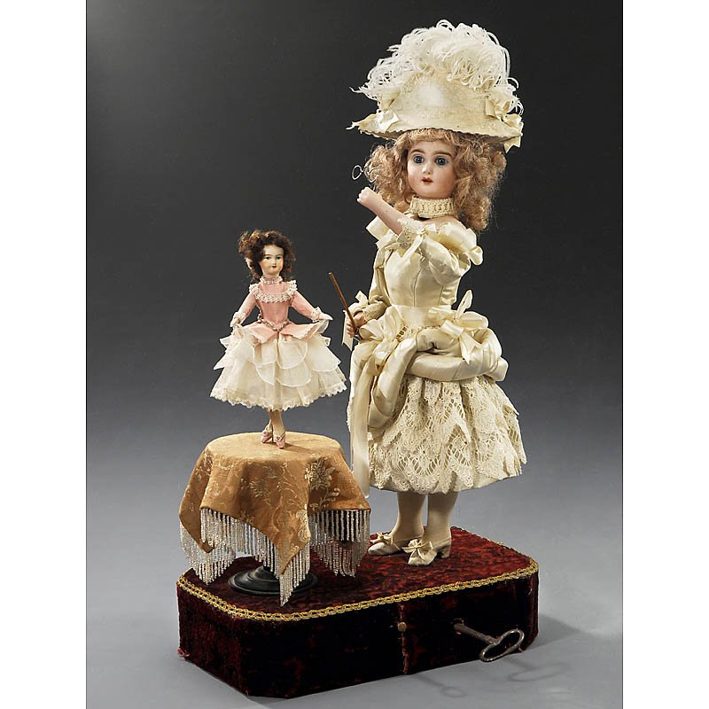 "Dancing Lesson" Musical Automaton by Decamps, fro: "Dancing Lesson" Musical Automaton by Decamps, from 1910 With S.F.B.J. era bisque socket head stamped "Tête Jumeau", open mouth, fixed blue paperweight eyes, pierced ears, synthetic wig, bisque shoul
