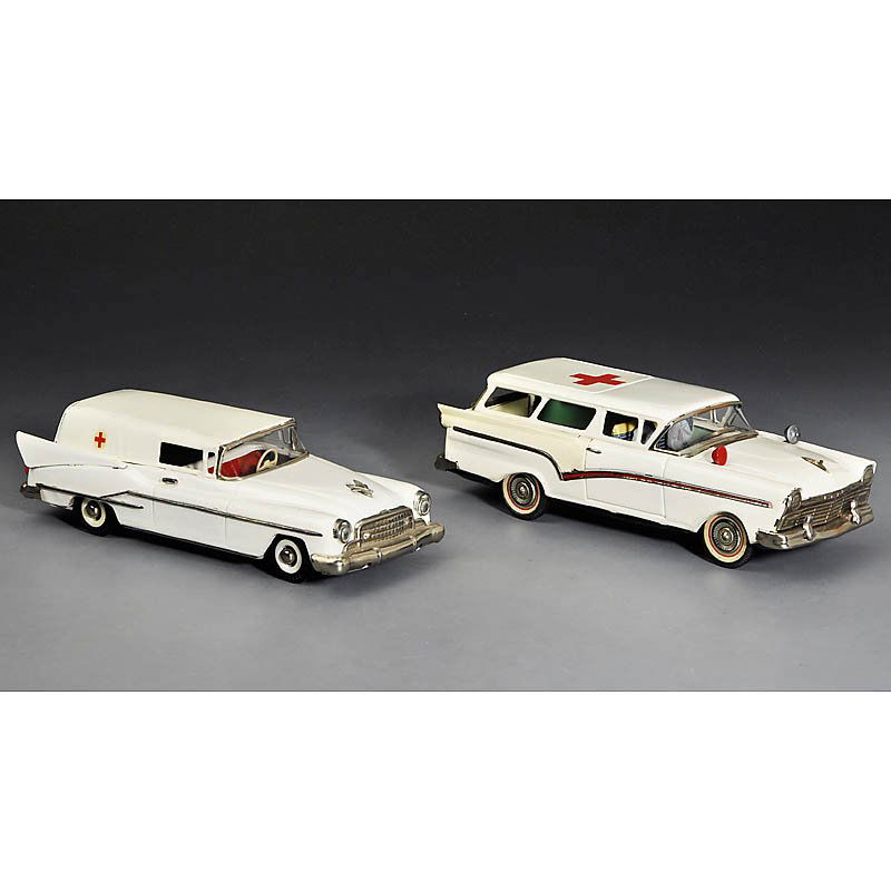 2 Tin Toy Ambulance Cars, c. 1960: 2 Tin Toy Ambulance Cars, c. 1960 1) "Günthermann", Germany, painted tin, friction, with stretcher, length 11 in. - And: 2) "Bandai", Japan, painted tin with lithographed interior, friction, rear bum
