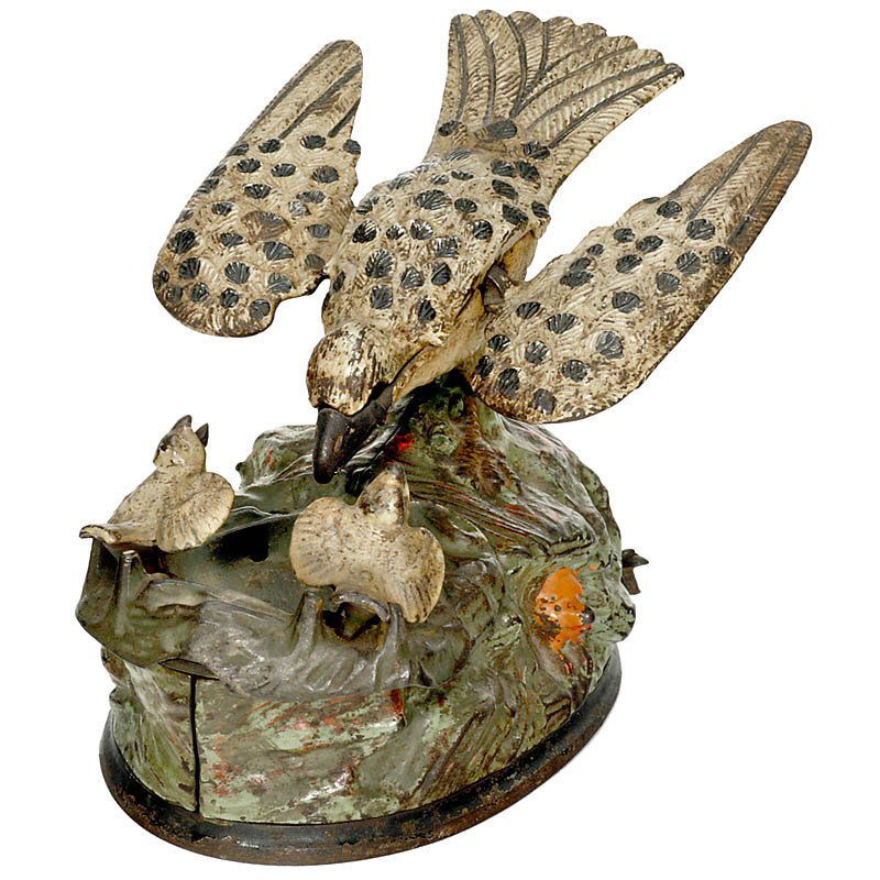 "Eagle and Eaglets" Mechanical Bank, from 1883: "Eagle and Eaglets" Mechanical Bank, from 1883 Manufacturer: "J. & E. Stevens USA", cast iron, with bellows inside for chirping sound (working), (1 wing hangs down, missing glass eyes, original paint