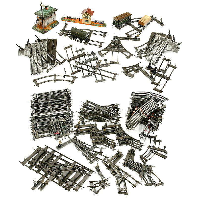 Large Lot of Rails etc. for Bing, Gauge 0: Large Lot of Rails etc. for Bing, Gauge 0 Manually operated, with 20 track switches, 6 stop rails, 5 crossings, approx. 160 rails, 3 wagons and 2 lithographed railway buildings. - Add-on: 8 switches a