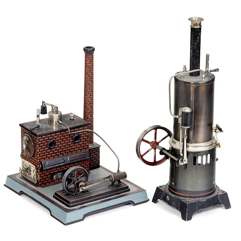 2 Steam Engines "Doll", c. 1920: 2 Steam Engines "Doll", c. 1920 Manufactured by "Doll & Cie.", Nuremberg. 1) Vertical steam engine no. 320/5, flywheel Ø 3 1/3 in., size 4 3/4 x 6 1/4 x 15 3/4 in. - And: 2) Horizontal steam engine n
