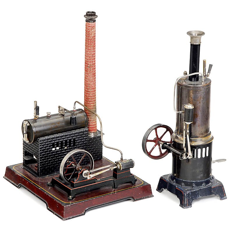 2 Steam Engines "Doll", c. 1920: 2 Steam Engines "Doll", c. 1920 Manufactured by: "Doll & Cie.", Nuremberg. 1) Vertical steam engine no. 321/4, flywheel Ø 3 in., size 5 1/2 x 4 1/3 x 14 1/5 in. - And: 2) Horizontal steam engine no. 