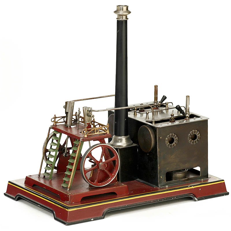 Ship's Steam Engine by Doll (340), 1914: Ship's Steam Engine by Doll (340), 1914 Double-boiler machine, with 2 oscillating cylinders, japanned tin, diameter of the flywheels 2 3/4 in., size 11 2/5 x 7 4/5 x 12 1/2 in., complete with all fitt