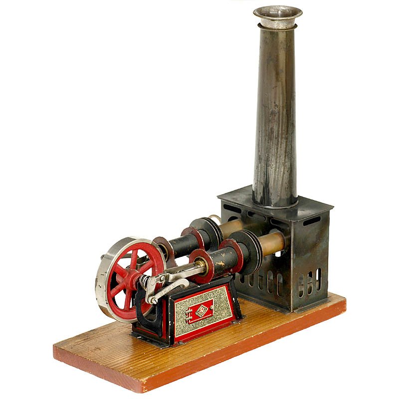 Hot-Air Engine by Bing (135/12), c. 1912: Hot-Air Engine by Bing (135/12), c. 1912 With 2 working and 2 displacing cylinders housed inside each other, flywheel Ø 2 1/3 in., on wooden base, size: 8 3/4 x 4 x 9 1/2 in., complete with burner. H
