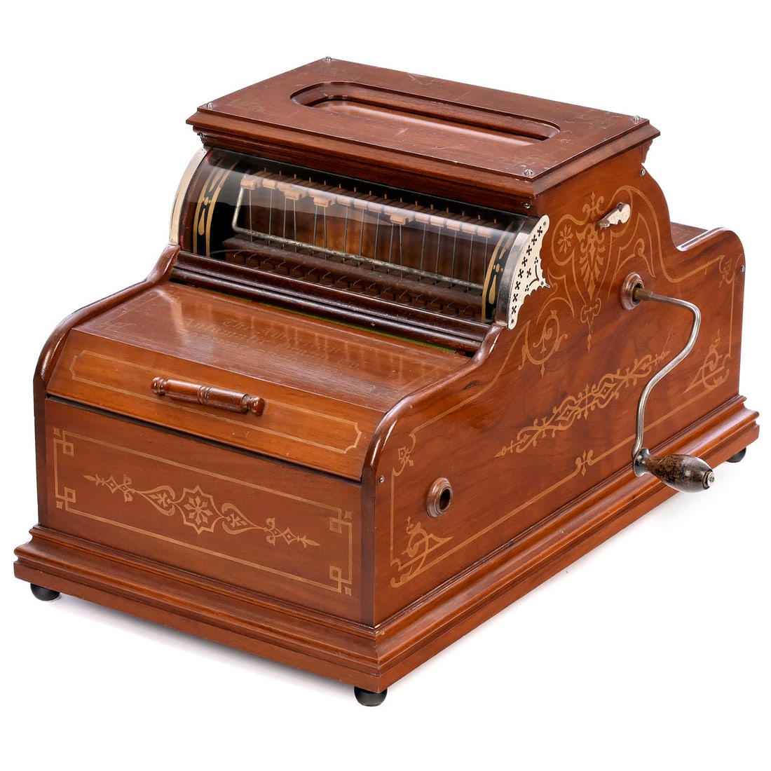 16-Note Cabinet Organina Organette, c. 1890: 16-Note Cabinet Organina Organette, c. 1890 American Automatic Organ Co. For 8 ¾ in. wide perforated music rolls with up to ten tunes, with hand-turned movement, walnut case with gilt-stenciled d