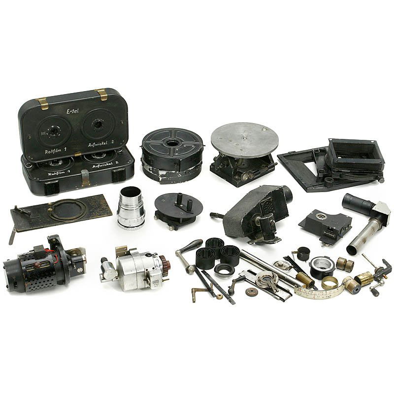 2 Cases with Movie Film Accessories, c. 1920-40: 2 Cases with Movie Film Accessories, c. 1920-40 1 handcrank head, 2 x bellows compendium, 2 motors, telescope viewer for cartoon camera, 2 rare cassettes for large Ertel camera and more. 2 Koffer mit