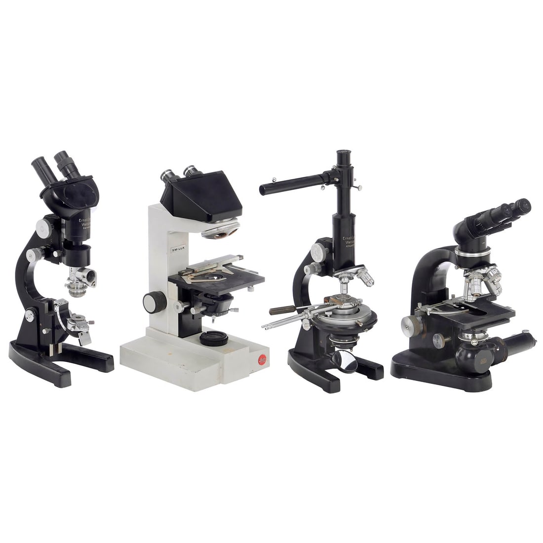 4 Ernst Leitz Microscopes: 4 Ernst Leitz Microscopes Wetzlar. 1) Laborlux SM, binocular microscope, no. 496227, 1956, electric illumination, condenser, rectangular stage, quadruple turret with objectives, binocular tube l.25x, 