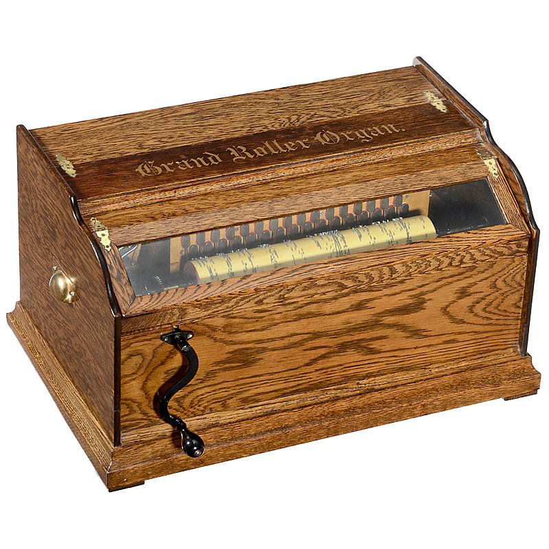Rare Autophone Co. "Grand Roller Organ", c. 1906: Rare Autophone Co. "Grand Roller Organ", c. 1906 For 13 ¼ in. (34 cm) spirally-pinned wooden cylinders, with 32-note action, crank and oak case, width 23 ½ in. (64 cm), with seven old and six new cy