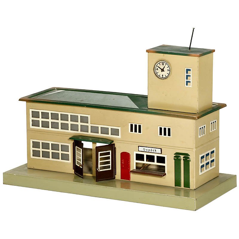 "Märklin" Station, Model 2011B, Gauge 0, from 1936: Märklin Station, Model 2011B, Gauge 0, from 1936 Hand-painted tin, opening doors, electric light, size: 15 x 6 ¾ x 9 ½ in. Very good original condition. Bahnhof "Märklin" Modell 2011B Spur 0, ab 1