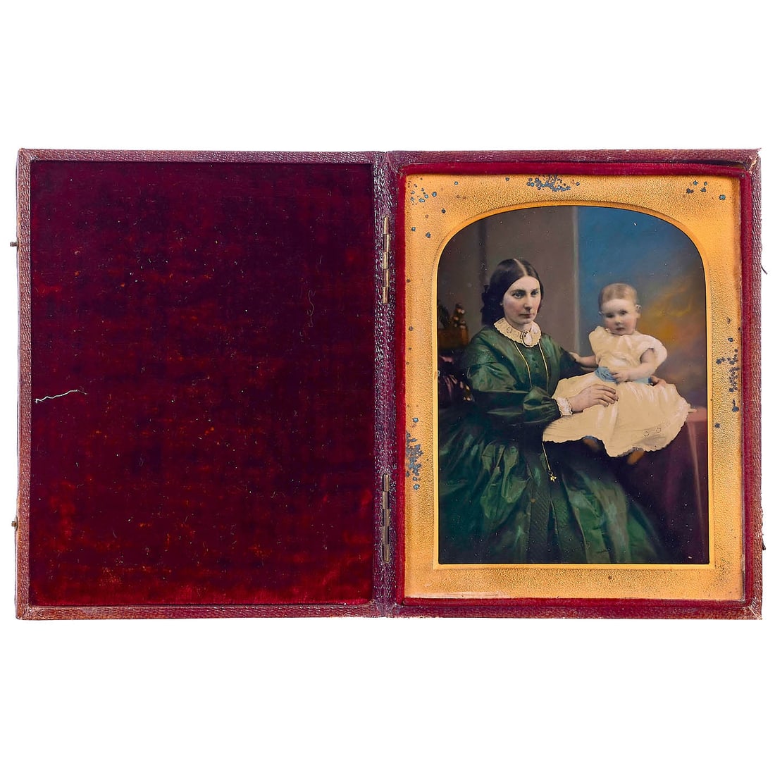 A Work of Art as an Ambrotype, c. 1859: A Work of Art as an Ambrotype, c. 1859 In a leather case, 11 x 14 cm, a truly outstanding photograph of a young mother and child, she in a green silk evening gown with a medallion on her lace
