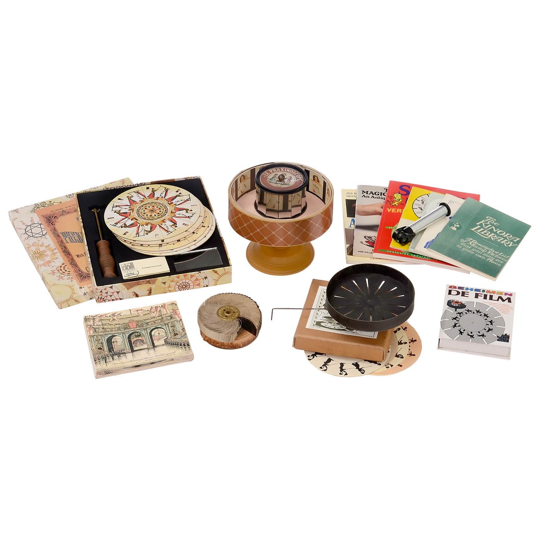 Original Kinora Reel, Diorama, and 4 Replica Optical Toys: Original Kinora Reel, Diorama, and 4 Replica Optical Toys 1) Kinora Ltd., London. Original Kinora reel No. 1571 (Dog playing in the snow), with original cardboard box. Includes 2 booklets as