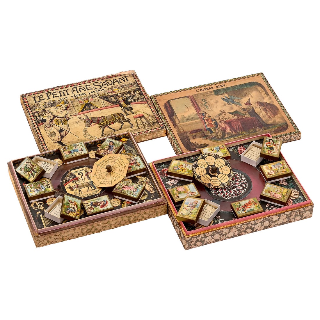2 Magnetic Fortune Telling Games, c. 1890: 2 Magnetic Fortune Telling Games, c. 1890 France. 1) "L'Oiseau bleu", with spinning blue bird and 8 boxes revealing fortune cards, lithographed lid depicting a wizard, a couple, a blue bird and a witc