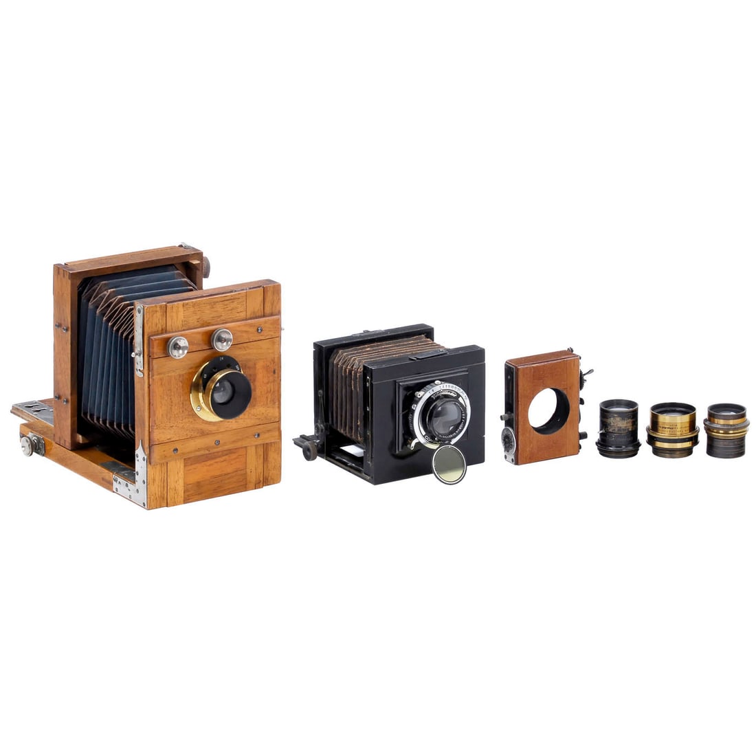 2 Field Cameras in 9 x 12 and 6.5 x 9 cm, c. 1920: 2 Field Cameras in 9 x 12 and 6.5 x 9 cm, c. 1920 Germany; both feature ground-glass backs. 1) Walnut wood with nickel-plated fittings, designed for 9 x 12 cm plates; features a green bellows with bro