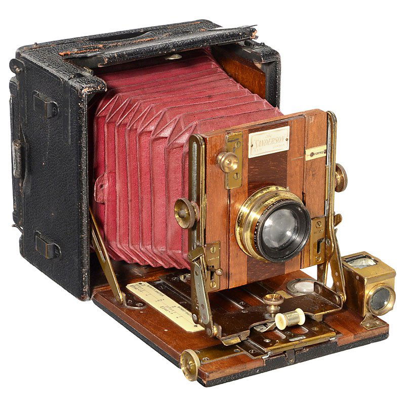 The Sanderson, c. 1896: The Sanderson, c. 1896 Sanderson Camera Works, England. Size 3 ¼ x 4 ¼ in., red bellows, finely-polished wood, leather-covered body, small lever missing, brass-bound "Doppel-Anastigmat Typ B Serie I