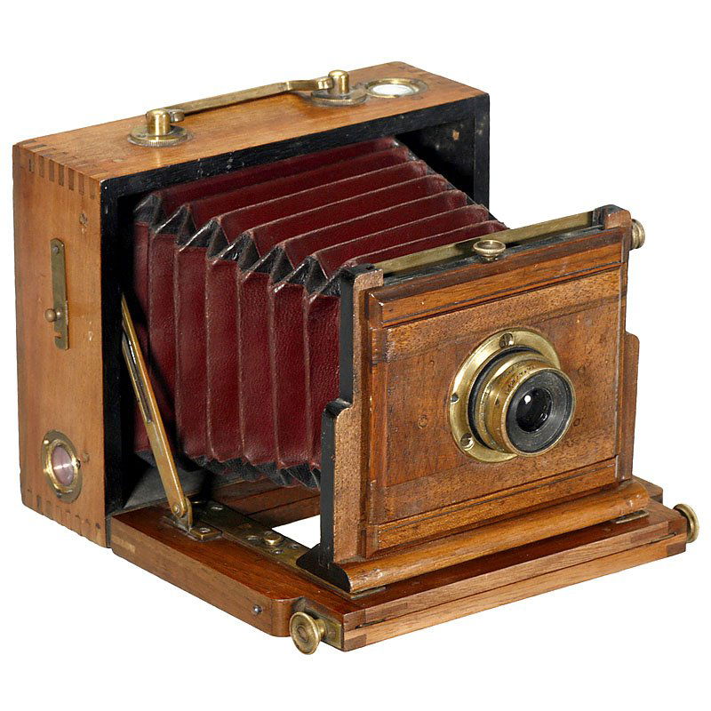 Folding Plate Camera 9 x 12 cm, 1896: Folding Plate Camera 9 x 12 cm, 1896 Presumably France. Plate size 3 ½ x 4 ¾ in., tropical wood with brass trim, nice brass lens by Carl Zeiss: "Anastigmat 1:8 F=110 mm", no. 17173, dark-red bellows