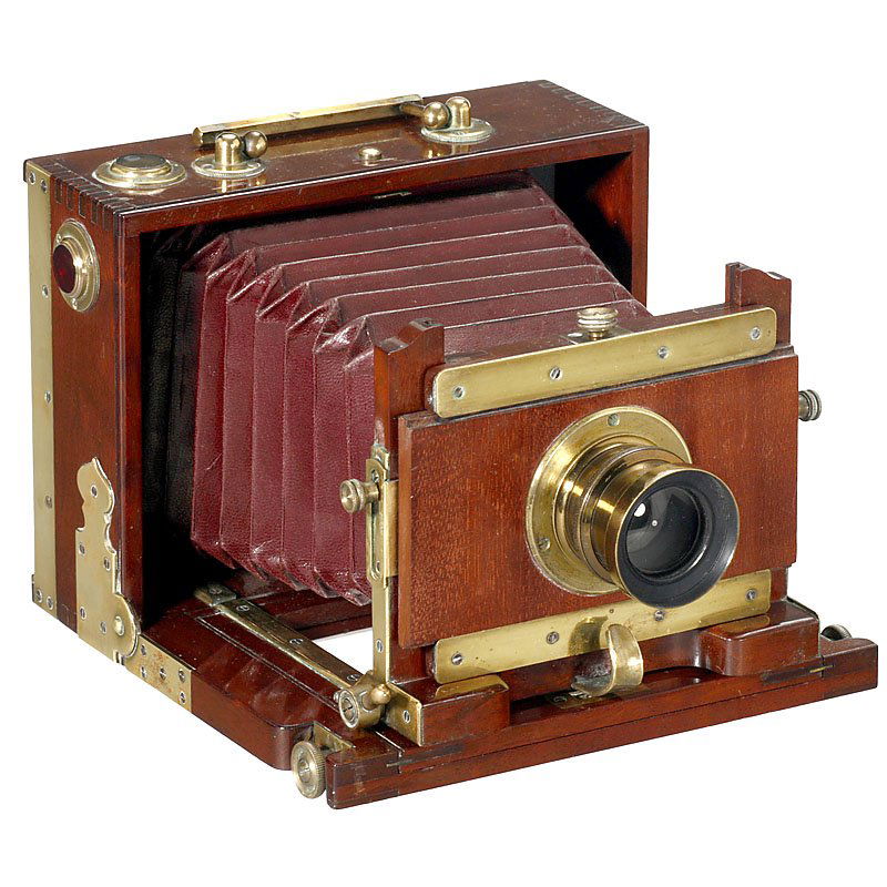 Noble Folding-Bed Camera from France, c. 1900: Noble Folding-Bed Camera from France, c. 1900 Unmarked, plate size 9 x 12 cm, mahogany body with noble brass fittings, dark-red bellows, lens: "Aplanétique Hotel de Ville" F:8, iris stop, with focusi