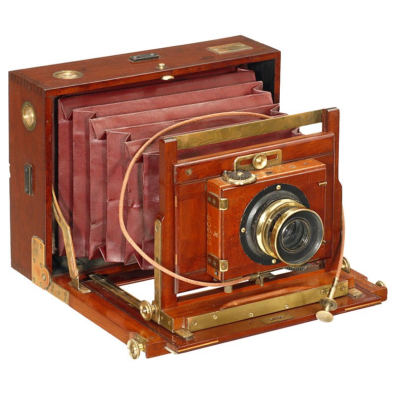 Folding Plate Camera by Charles Mendel, c. 1900: Folding Plate Camera by Charles Mendel, c. 1900 Charles Mendel, France. Size 13 x 18 cm, cherry with brass trim, dark-red bellows, lens: H. Roussel, Paris, "Anti Spectroscopique F:6,8 180 mm", in Thor