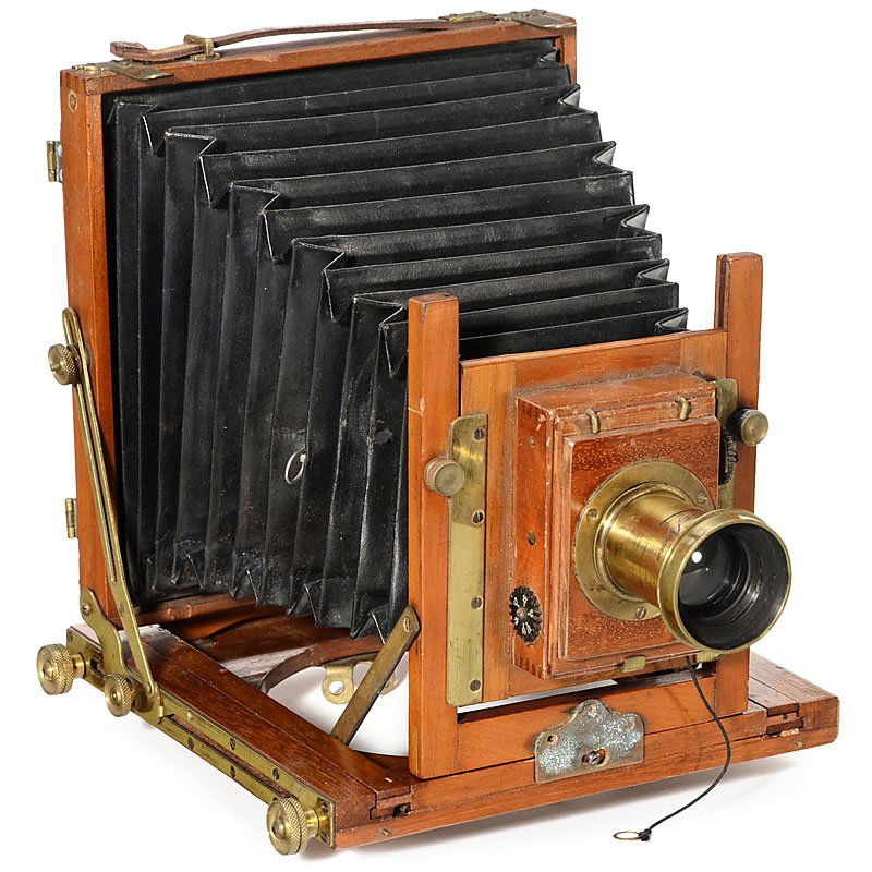 English Field Camera with Dallmeyer Lens, c. 1900: English Field Camera with Dallmeyer Lens, c. 1900 Unmarked, size 4 ¾ x 6 ¾ in., tropical wood with brass fittings, black conical bellows, brass-bound "Rapid Rectilinear 6 x 5 F1:8" lens by Dallmeyer