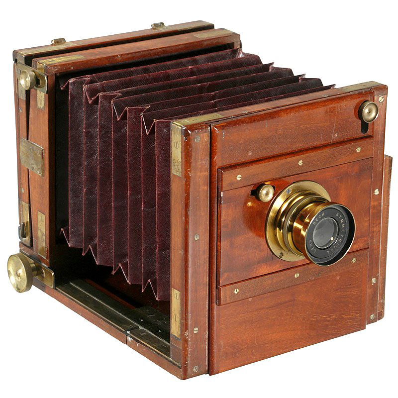 4 ¾ x 6 ¼ in. Field Camera from England, c. 1890: 4 ¾ x 6 ¼ in. Field Camera from England, c. 1890 Unmarked, for plates with size 4 ¾ x 6 ¼ in., tropical wood with brass fittings, lens: "Beck Symmetrical Lens F:8", dark-red bellows, focusing scre