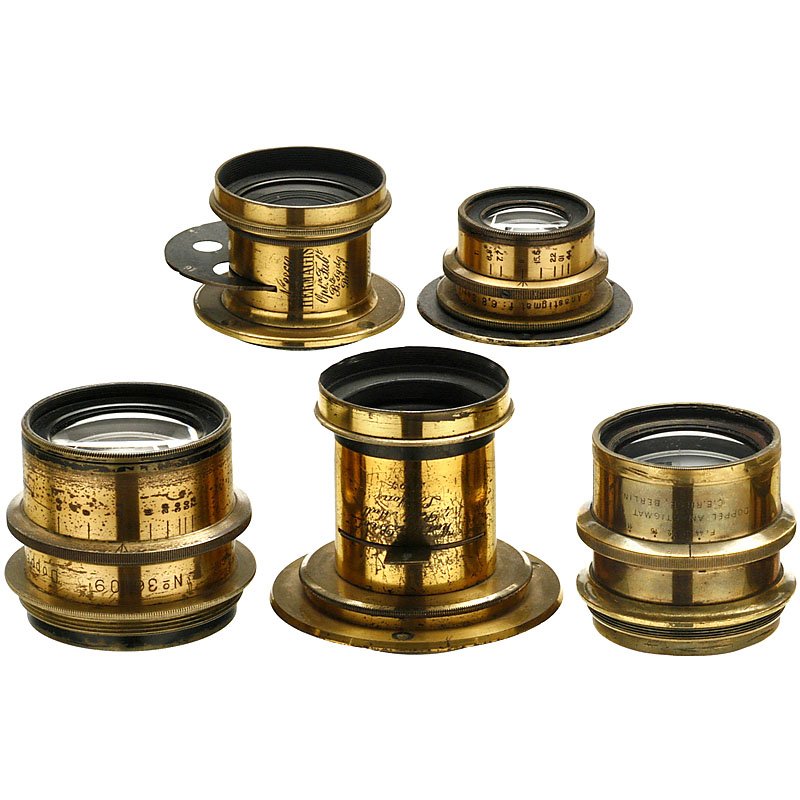 5 Brass Lenses, 1885–1900: 5 Brass Lenses, 1885–1900 1) Rodenstock, Munich. Doppel-Anastigmat "Eurynar" 6,8/24 cm, iris stop, height 2 in., Ø 2 1/3 in. (3/3) – 2) Tauber, Wiesbaden. Doppel-Anastigmat F:6,8 Serie I 135 mm, 