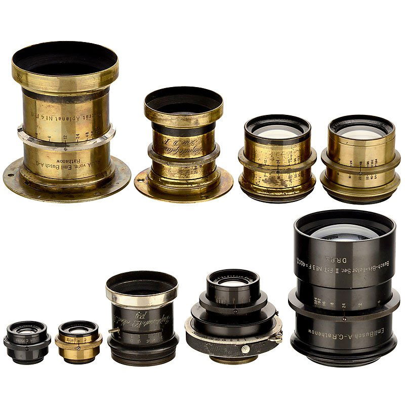 9 Brass-Bound Lenses by E. Busch: 9 Brass-Bound Lenses by E. Busch R.O.J.A. vorm. Emil Busch, Rathenow. 1) Portrait Aplanat No. 4 F:6, iris stop, height 4 ¾ in., Ø 3 ½ in., connecting ring. – 2) Rapid Aplanat No. 4 Serie D F:8, i