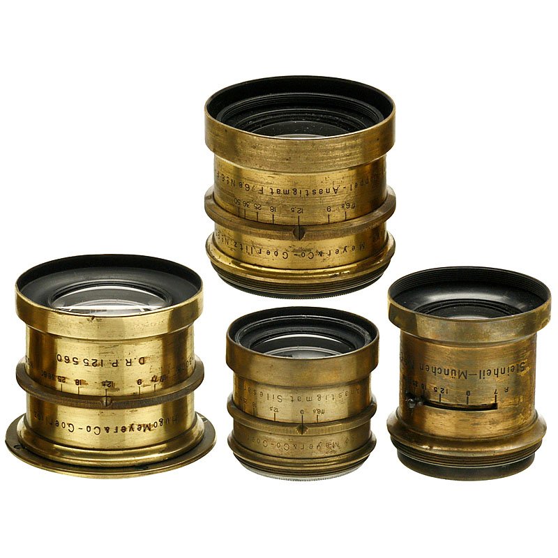 4 Brass Lenses by Meyer Görlitz and Steinheil: 4 Brass Lenses by Meyer Görlitz and Steinheil Meyer, Görlitz. 1) Meyer-Doppel-Anastigmat F:6,8 No. 6 F=300 mm, no. 95176, iris stop, height 2 1/3 in., Ø 2 1/3 in., with small dent in front ring. (3