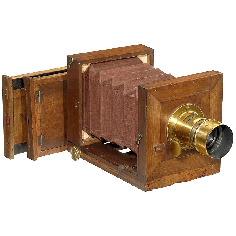 French Wet-Plate Camera with Petzval-Type Lens by: French Wet-Plate Camera with Petzval-Type Lens by Soupault, 1865–70 Unmarked, photograph format approx. 4 1/3 x 4 1/3 in., polished wood with brass trim, brown bellows, focusing screen back and 2