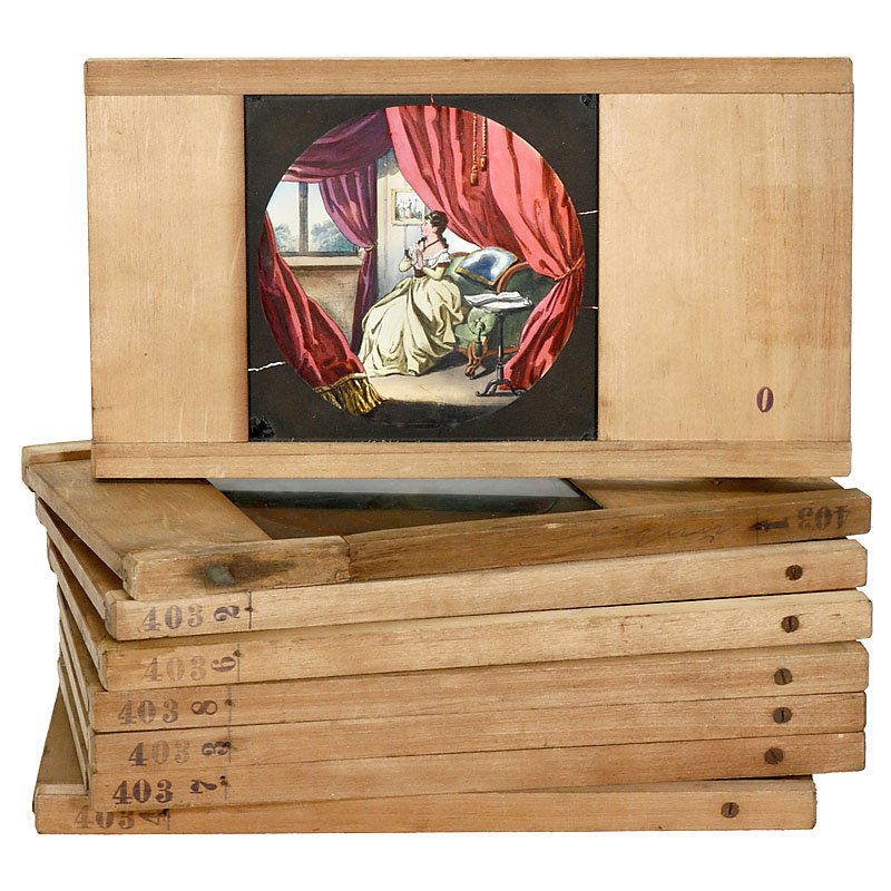 Large Dissolving Slides "Girl's Dream": Large Dissolving Slides "Girl's Dream" 8 wooden framed slides, the story of dreaming girl, 6 ¼ x 11 ¾ in., prints, but hand-colored, print size 5 x 5 in. – Very nice and rare series! Große Nebe