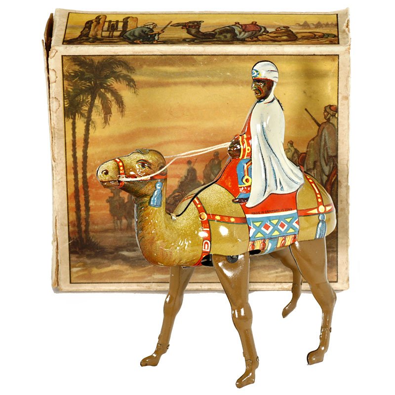 Camel with Beduin Rider by Keim, c. 1950: Camel with Beduin Rider by Keim, c. 1950 No. 901, made in U.S.-Zone Germany, lithographed tin, clockwork (working), length 5 ½ in., very good condition, with parts of the original box. Kamel mit Bedu