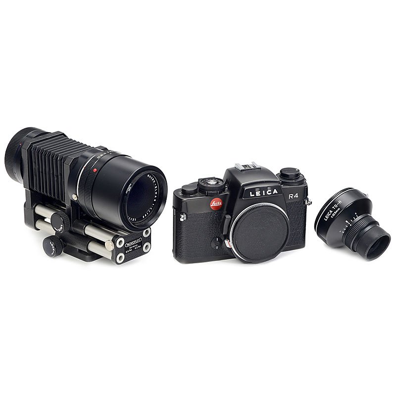 Leica R4, Macro-Elmar 4/100 and Accessories: Leica R4, Macro-Elmar 4/100 and Accessories 1) Leitz, Portugal. Leica R4, 1981, no. 1573962, light meter working, body cap. (2-/1-) – 2) Leitz, Wetzlar. Macro-Elmar 4/100 mm, no. 2416715, with Novof