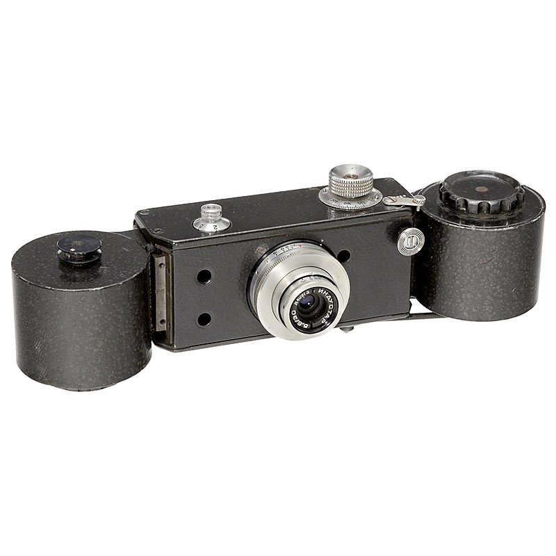 Soviet KGB Observation Camera: Soviet KGB Observation Camera USSR, special camera 18 x 24 mm for 35mm film, special cassettes, mechanical rather than electric drive! Lens 5,6/30 mm, gloss finish, shutter 1/20–1 sec., B. Mint cond