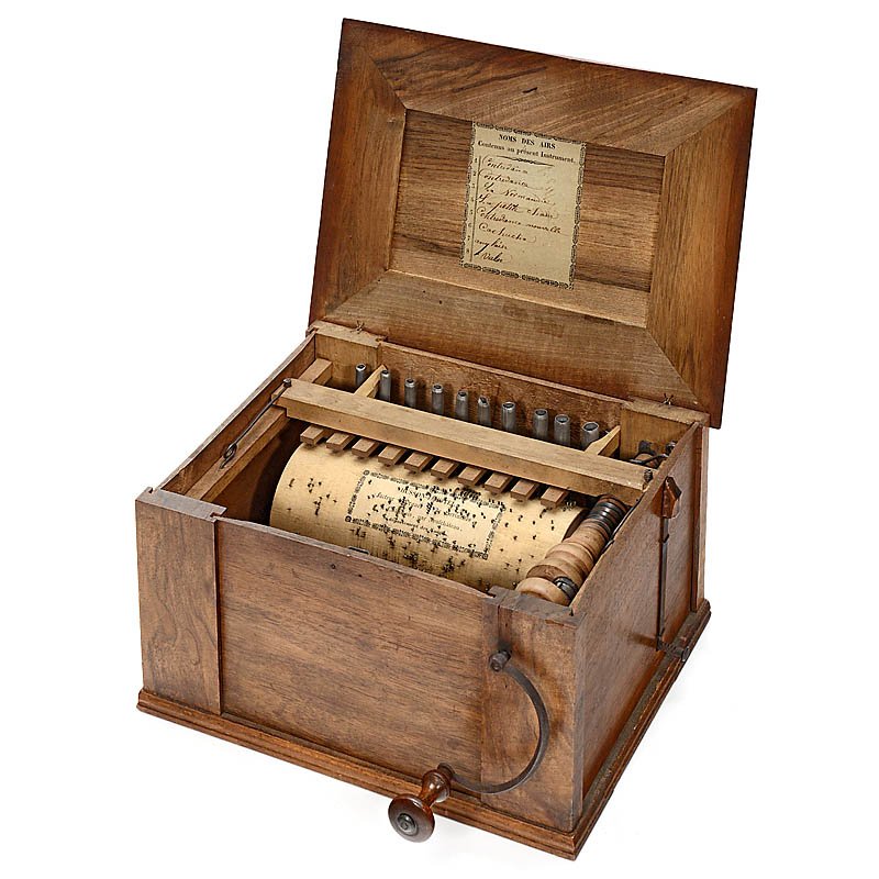 Small French Barrel Organ "Serinette", c. 1850: Small French Barrel Organ "Serinette", c. 1850 With maker's label on pinned wooden barrel "Husson-Jacotel, Chatenois", 8 tunes, length of the barrel 6 2/3 in., 10 metal pipes, walnut case with origina